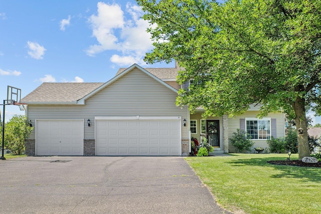 2418 Thrush St, Shakopee, MN 55379 - view of front of property featuring asphalt driveway, a front lawn, a garage, and a shingled roof