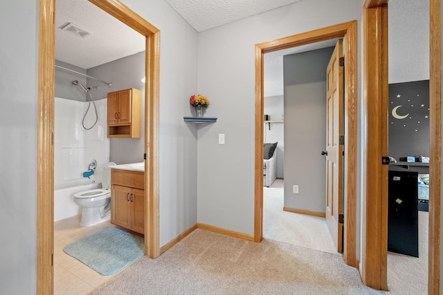 2418 Thrush St, Shakopee, MN 55379 - bathroom with shower / bath combination, vanity, a textured ceiling, and carpet