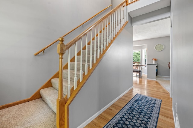 2418 Thrush St, Shakopee, MN 55379 - stairway featuring baseboards and wood finished floors