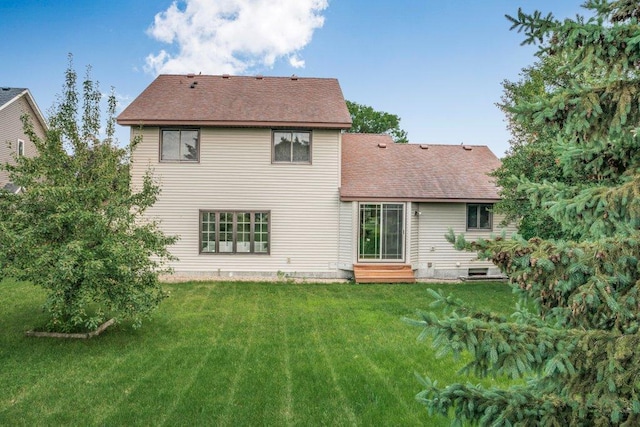 2824 92nd Cres N, Brooklyn Park, MN 55443 - rear view of house with a yard, entry steps, and a shingled roof