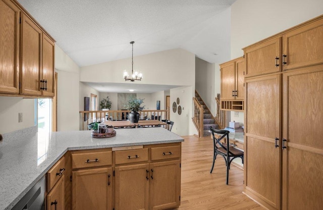 2824 92nd Cres N, Brooklyn Park, MN 55443 - kitchen with a peninsula, light wood-type flooring, a chandelier, vaulted ceiling, and decorative light fixtures