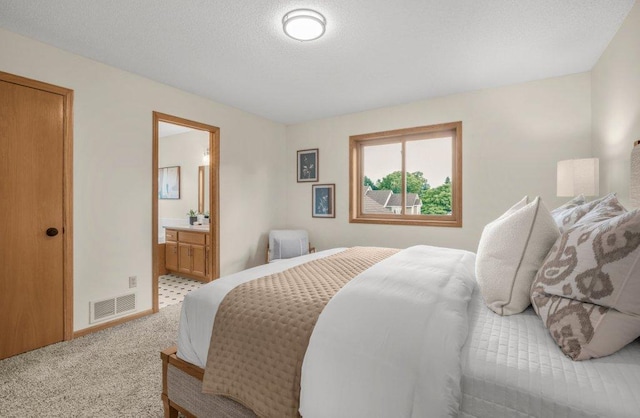 2824 92nd Cres N, Brooklyn Park, MN 55443 - carpeted bedroom with ensuite bath and baseboards