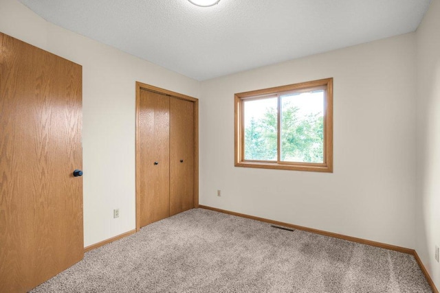 2824 92nd Cres N, Brooklyn Park, MN 55443 - unfurnished bedroom featuring carpet and a closet