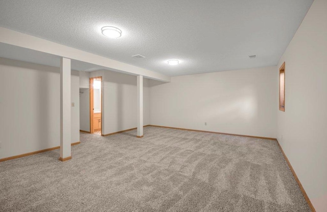 2824 92nd Cres N, Brooklyn Park, MN 55443 - finished below grade area with light colored carpet and a textured ceiling