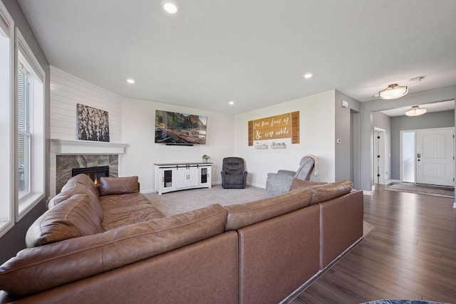 12745 39th St NE, Saint Michael, MN 55376 - living room with recessed lighting, a stone fireplace, and wood finished floors