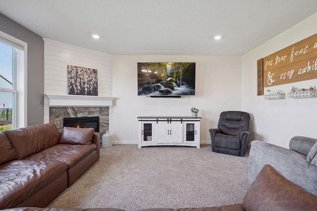 12745 39th St NE, Saint Michael, MN 55376 - living room with carpet flooring, a stone fireplace, and recessed lighting