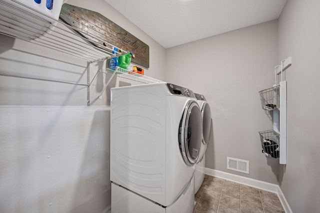 12745 39th St NE, Saint Michael, MN 55376 - laundry room with baseboards and washing machine and clothes dryer