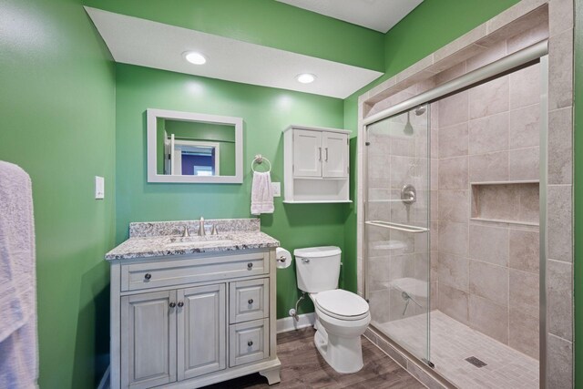 12745 39th St NE, Saint Michael, MN 55376 - full bathroom with vanity, a shower stall, and wood finished floors