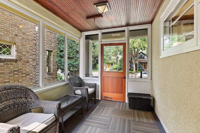 3343 Humboldt Ave S, Minneapolis, MN 55408 - sunroom featuring plenty of natural light, wooden ceiling, a textured wall, and carpet floors