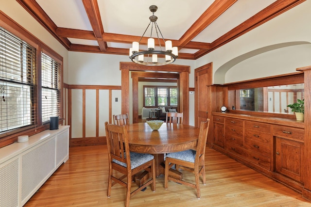 3343 Humboldt Ave S, Minneapolis, MN 55408 - dining room with radiator heating unit, a chandelier, coffered ceiling, light wood finished floors, and beamed ceiling