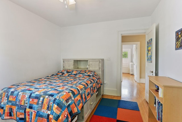 3343 Humboldt Ave S, Minneapolis, MN 55408 - bedroom with light wood-type flooring, radiator, and ceiling fan