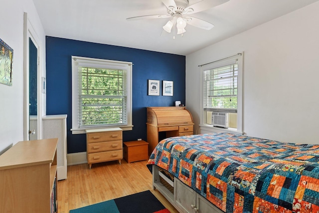 3343 Humboldt Ave S, Minneapolis, MN 55408 - bedroom with light wood-style flooring, cooling unit, and ceiling fan