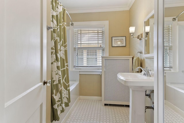 3343 Humboldt Ave S, Minneapolis, MN 55408 - bathroom with ornamental molding, shower / tub combo, tile patterned flooring, and tile walls
