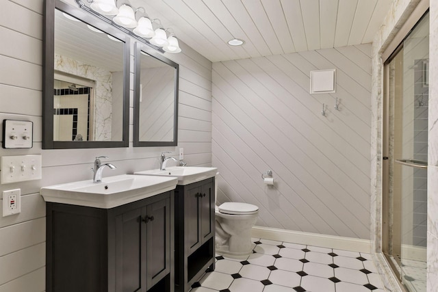 3343 Humboldt Ave S, Minneapolis, MN 55408 - bathroom featuring tile patterned floors, vanity, a shower stall, and wood walls