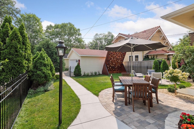 3343 Humboldt Ave S, Minneapolis, MN 55408 - fenced backyard with a patio area, outdoor dining area, and an outbuilding