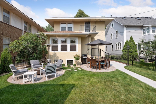 3343 Humboldt Ave S, Minneapolis, MN 55408 - back of house with stucco siding, a balcony, a patio area, and an outdoor living space with a fire pit