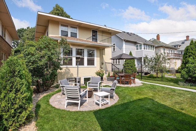 3343 Humboldt Ave S, Minneapolis, MN 55408 - back of house with stucco siding, a patio, and a balcony
