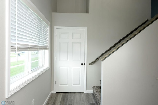 1040 Barnes Dr, West Fargo, ND 58078 - staircase with wood finished floors and baseboards