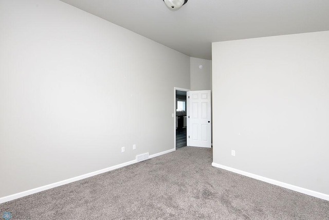 1040 Barnes Dr, West Fargo, ND 58078 - empty room featuring carpet flooring and high vaulted ceiling