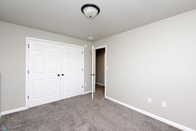 1040 Barnes Dr, West Fargo, ND 58078 - unfurnished bedroom featuring carpet floors and a closet