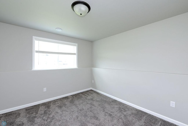 1040 Barnes Dr, West Fargo, ND 58078 - spare room featuring carpet and baseboards