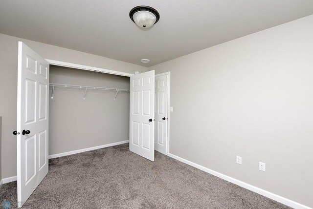 1040 Barnes Dr, West Fargo, ND 58078 - unfurnished bedroom with carpet and a closet