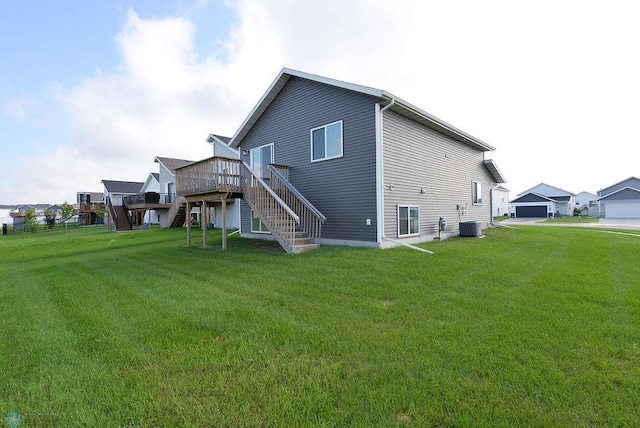 1040 Barnes Dr, West Fargo, ND 58078 - rear view of property featuring stairway, a deck, and a yard