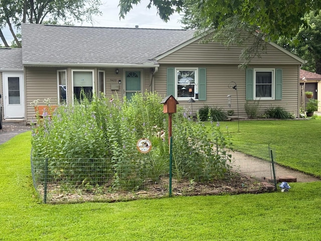 7420 Columbus Ave, Richfield, MN 55423 - view of front of home with a front lawn and roof with shingles