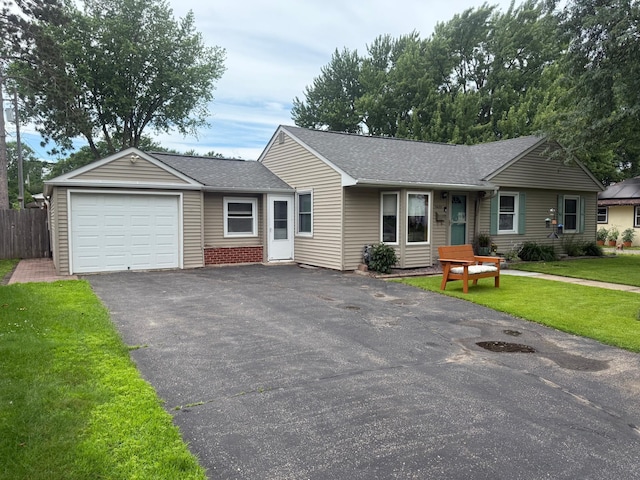 7420 Columbus Ave, Richfield, MN 55423 - ranch-style house featuring driveway, roof with shingles, and a garage