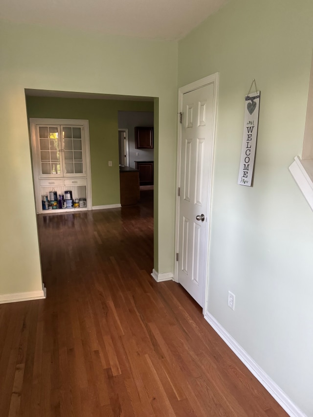 663 Smith Ave S, Saint Paul, MN 55107 - hall with dark wood-style floors and baseboards