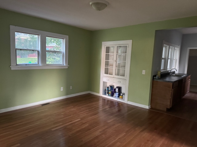 663 Smith Ave S, Saint Paul, MN 55107 - unfurnished dining area with dark wood-style flooring and baseboards