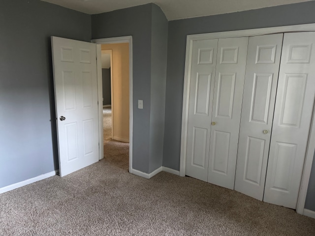 663 Smith Ave S, Saint Paul, MN 55107 - unfurnished bedroom with carpet flooring and a closet