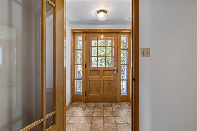 440 6th St, Lafayette, MN 56054 - entryway featuring baseboards and light stone finish flooring