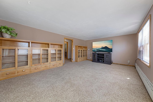 440 6th St, Lafayette, MN 56054 - unfurnished living room featuring a baseboard radiator, carpet floors, and healthy amount of natural light