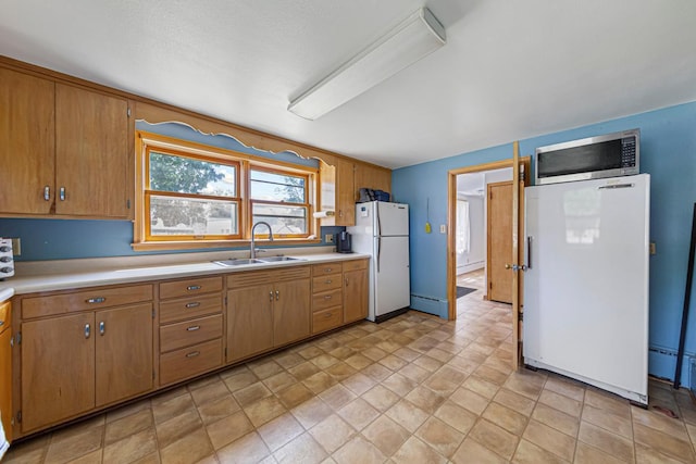 440 6th St, Lafayette, MN 56054 - kitchen with freestanding refrigerator, white fridge, stainless steel microwave, and light countertops
