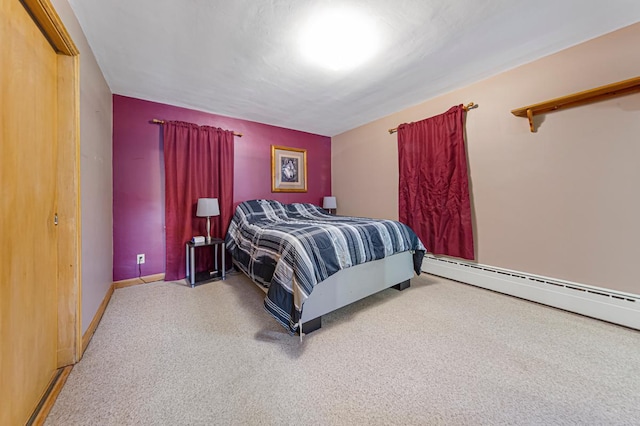 440 6th St, Lafayette, MN 56054 - carpeted bedroom with a baseboard heating unit and baseboards