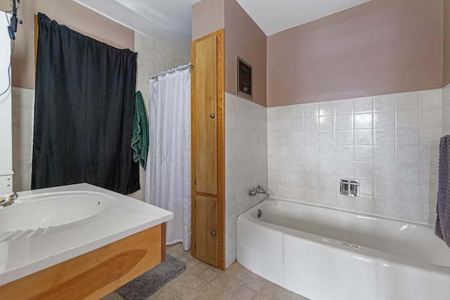 440 6th St, Lafayette, MN 56054 - full bath featuring a bath, vanity, tile walls, and tile patterned flooring
