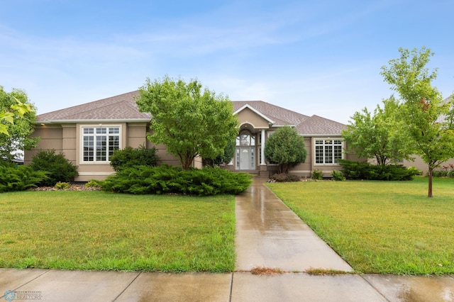 1811 7th St, Fargo, ND 58078 - ranch-style home featuring a front lawn, roof with shingles, and stucco siding