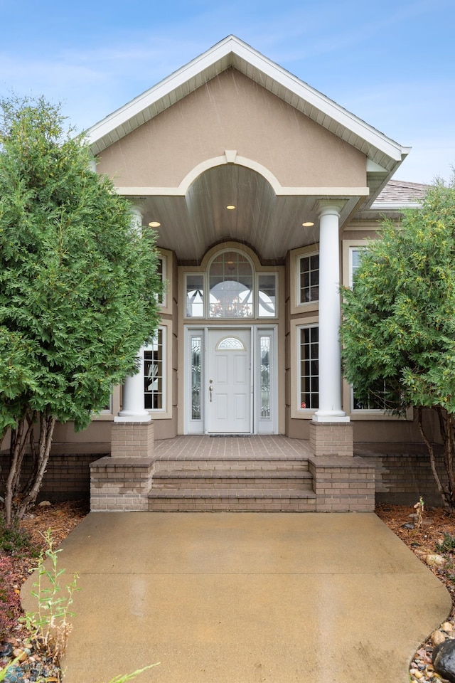 1811 7th St, Fargo, ND 58078 - property entrance featuring stucco siding and covered porch