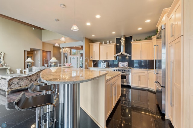 1811 7th St, Fargo, ND 58078 - kitchen with wall chimney range hood, high end appliances, decorative backsplash, light brown cabinetry, and recessed lighting