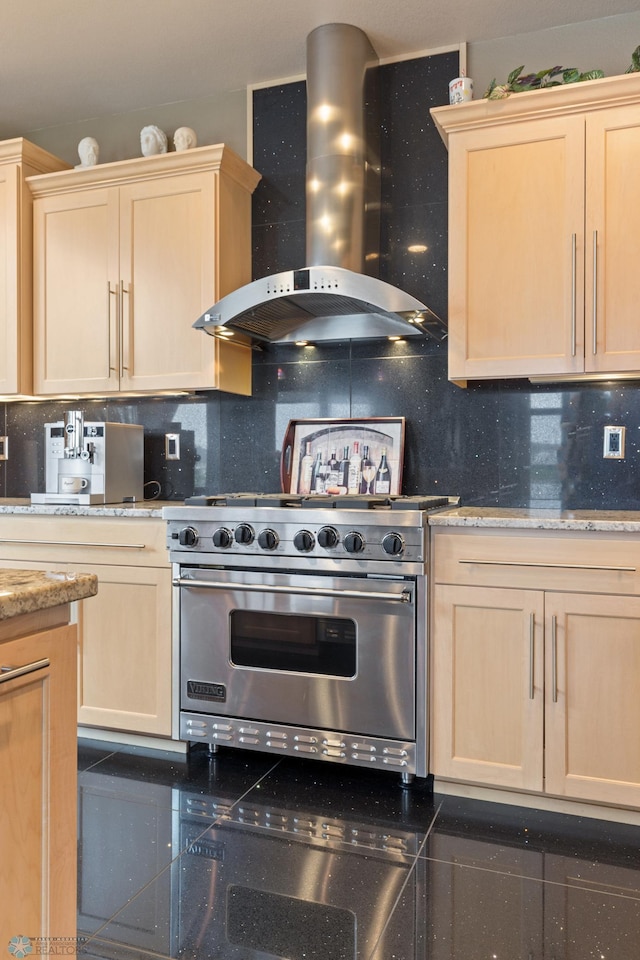 1811 7th St, Fargo, ND 58078 - kitchen featuring wall chimney range hood, designer stove, light brown cabinets, and backsplash