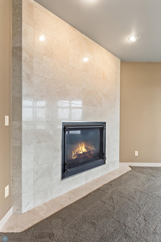 1811 7th St, Fargo, ND 58078 - detailed view of a tile fireplace, carpet flooring, and recessed lighting