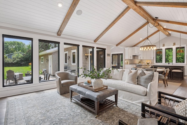 5815 Howards Point Rd, Shorewood, MN 55331 - living room with light wood-style floors, wooden ceiling, and a chandelier