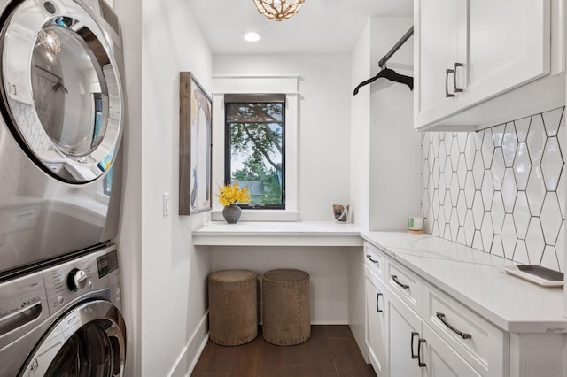 5815 Howards Point Rd, Shorewood, MN 55331 - laundry area with cabinet space, stacked washing machine and dryer, dark wood-style flooring, and recessed lighting