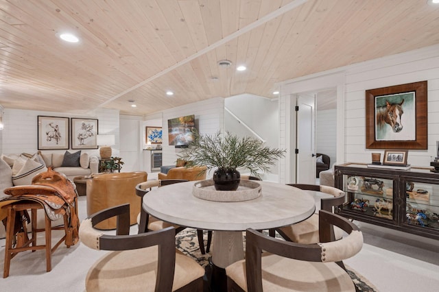 5815 Howards Point Rd, Shorewood, MN 55331 - dining space featuring wooden ceiling, recessed lighting, wooden walls, carpet floors, and stairway
