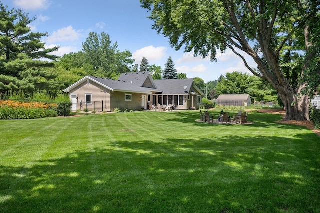 5815 Howards Point Rd, Shorewood, MN 55331 - back of property featuring a fire pit and a lawn