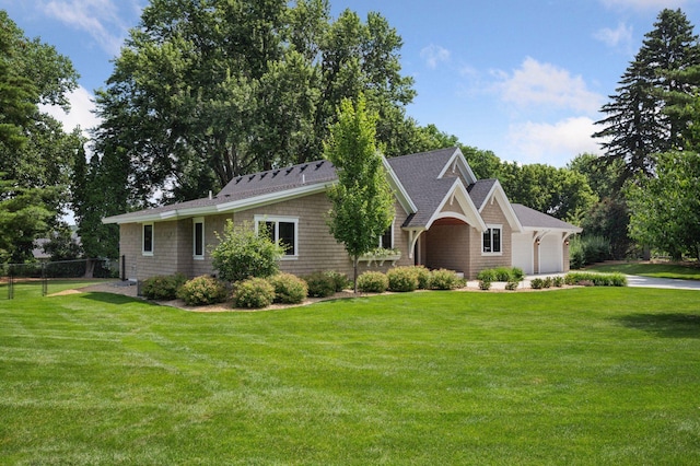 5815 Howards Point Rd, Shorewood, MN 55331 - view of front of property with roof with shingles, driveway, and a garage