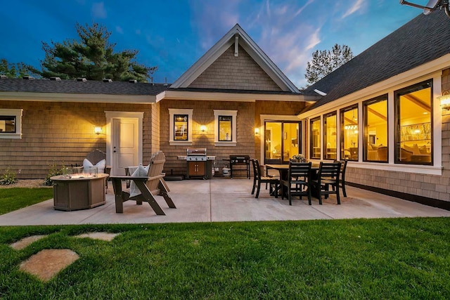 5815 Howards Point Rd, Shorewood, MN 55331 - rear view of house with a fire pit, a yard, and a patio