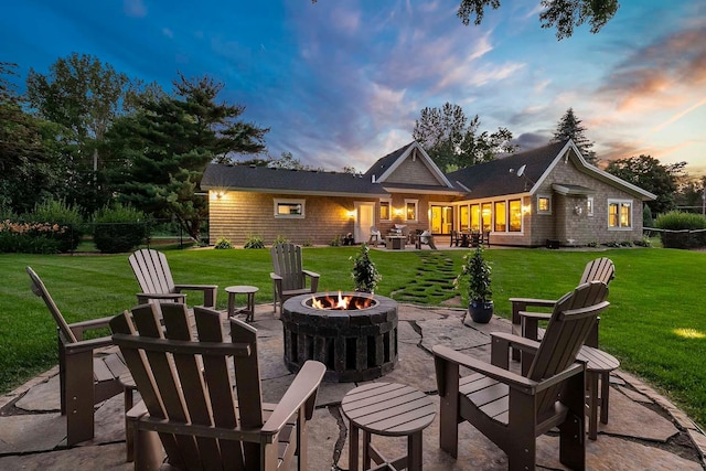 5815 Howards Point Rd, Shorewood, MN 55331 - back of property with an outdoor fire pit, a patio, and a yard