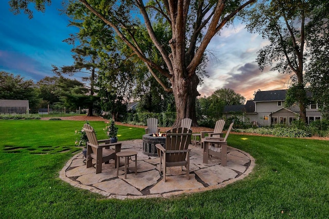 5815 Howards Point Rd, Shorewood, MN 55331 - yard at dusk with an outdoor fire pit and a patio